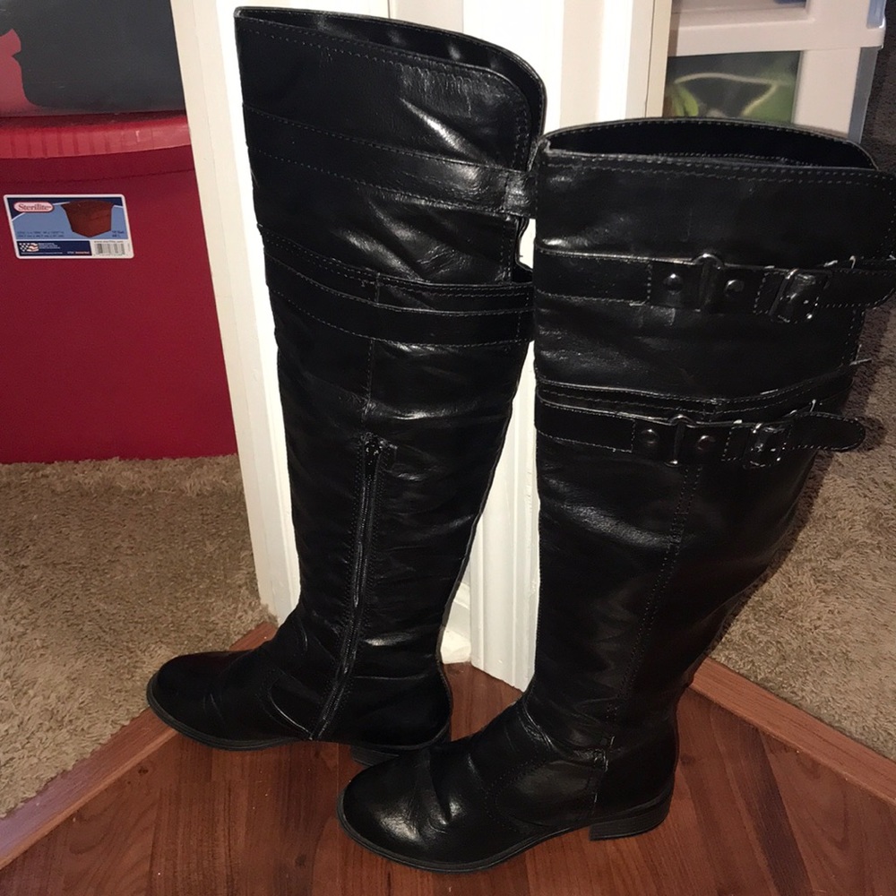 Over the knee black boots. Not a real leather.